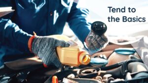 Person in gloves pouring oil into a car engine with the text "Tend to the Basics" displayed on the right side.