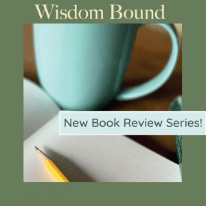 A teal mug next to an open notebook with a pencil rests on the notebook. The image includes text: "Wisdom Bound" at the top and "New Book Review Series!" over the notebook.